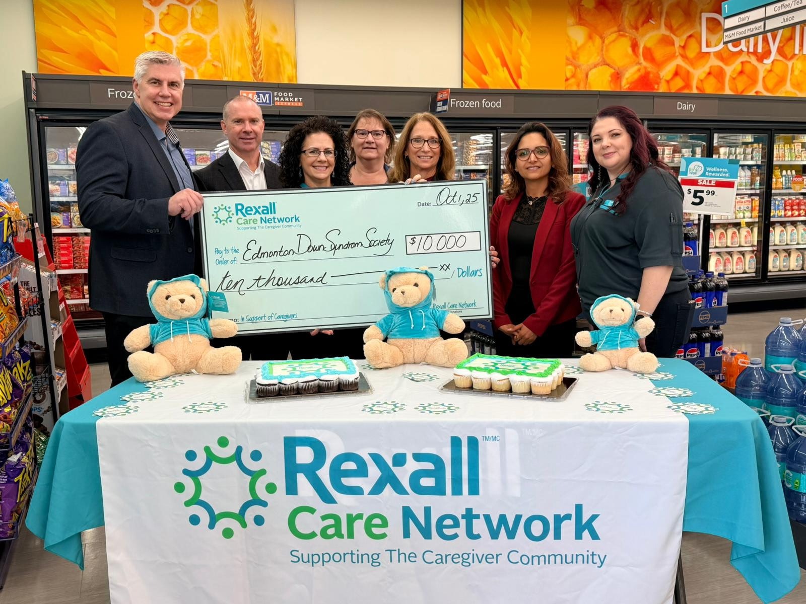 Rexall Care Network team presenting a donation cheque.