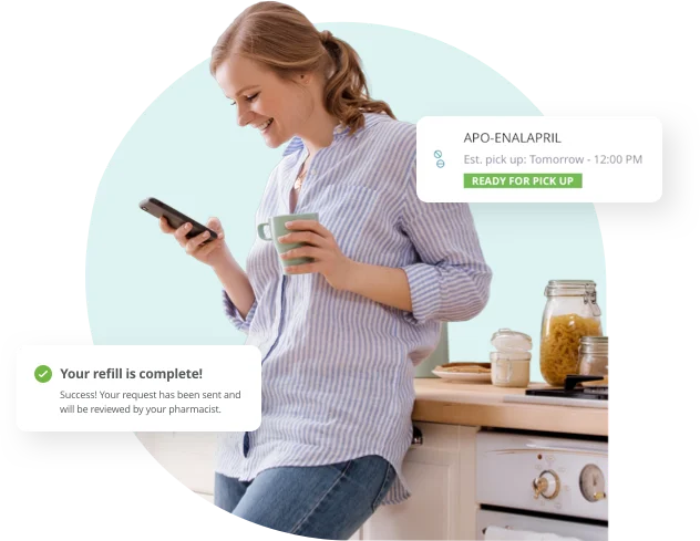 A person using a phone beside prescription refill notifications