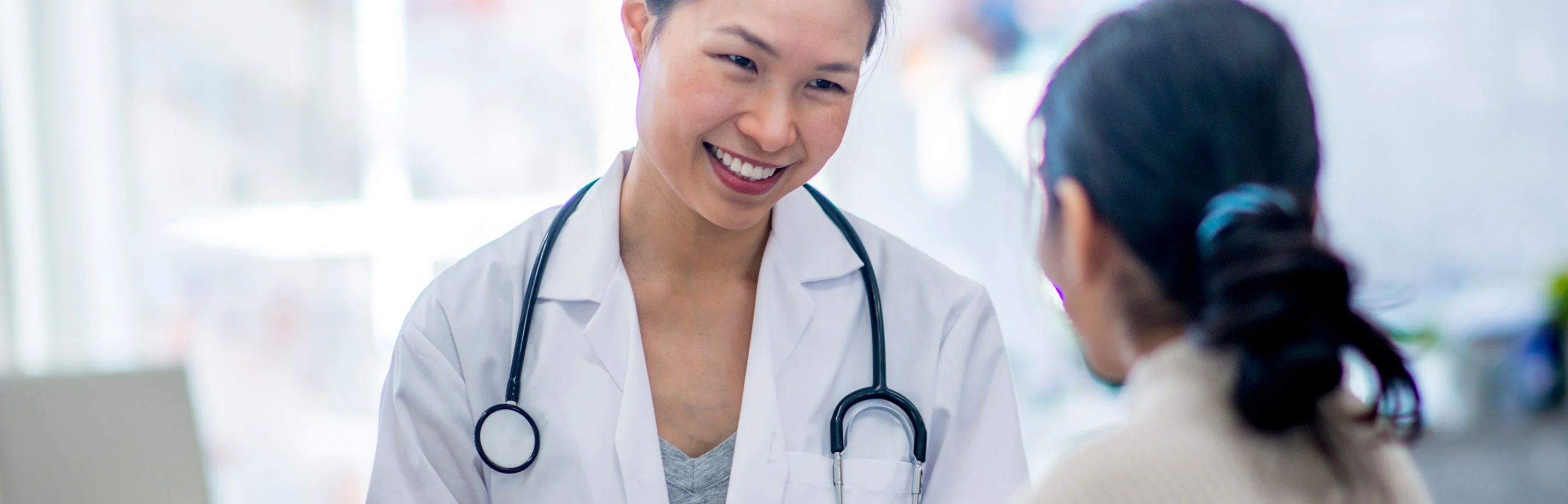 Pharmacist consulting with a patient about specialty medication