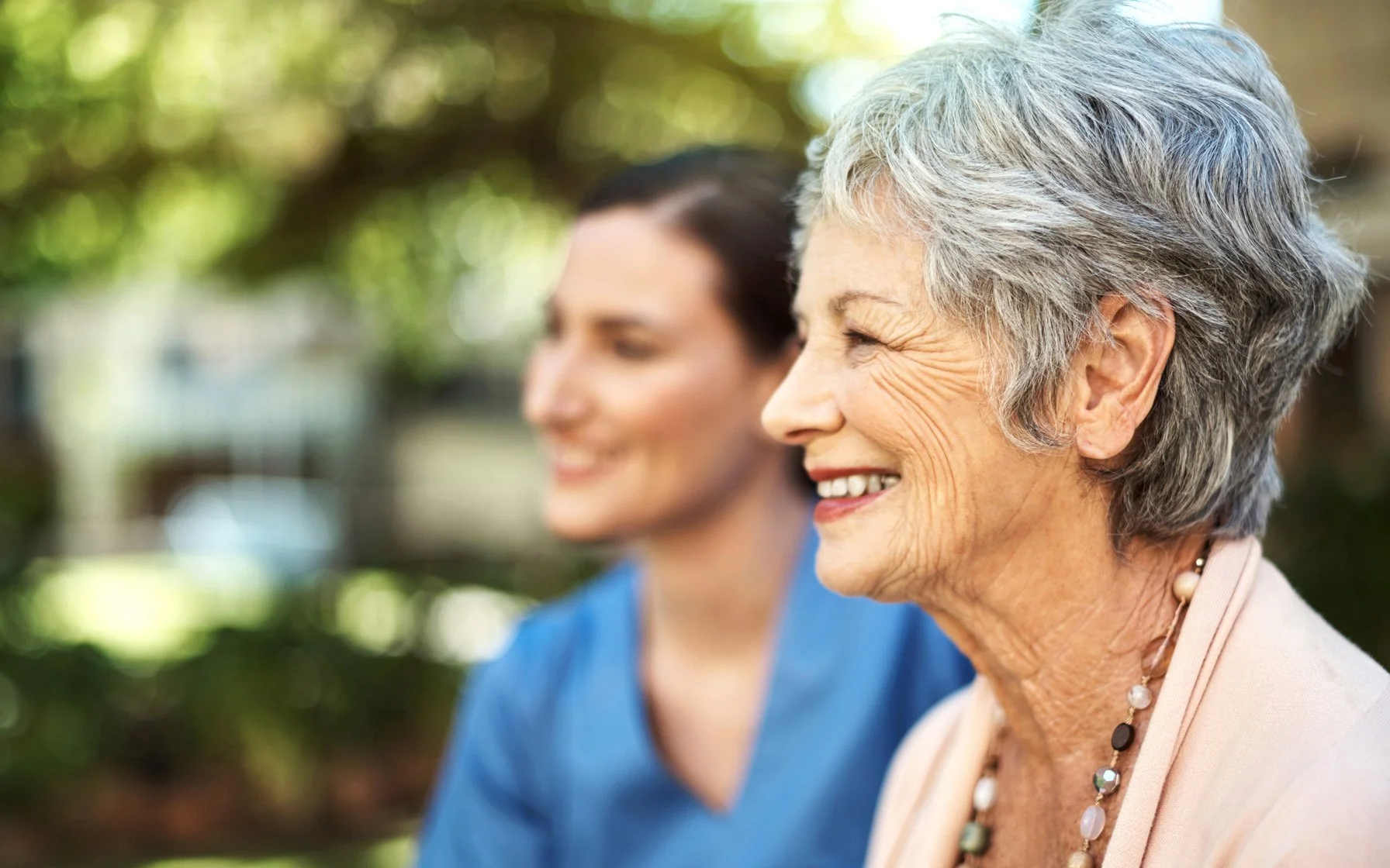 Smiling patient speaking with a pharmacist