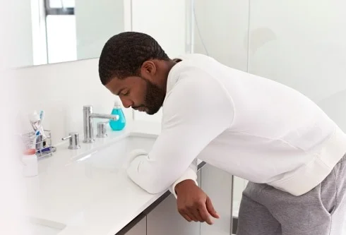 Person experiencing stomach discomfort