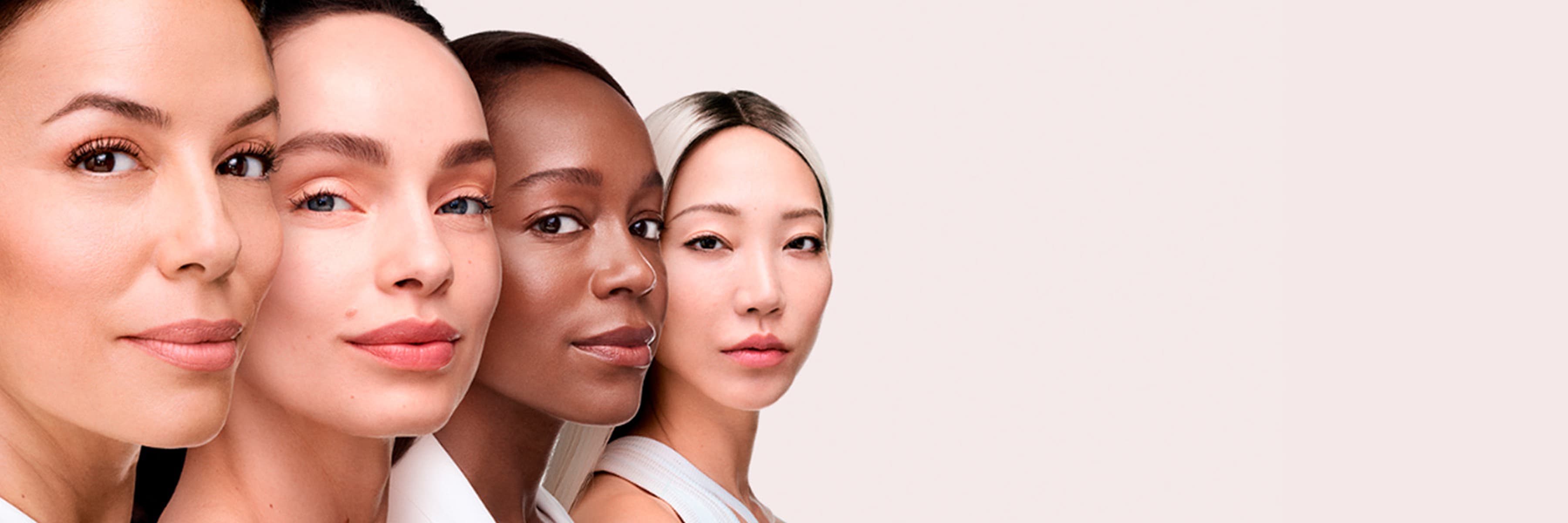 Four women of different ages and skin tones side by side