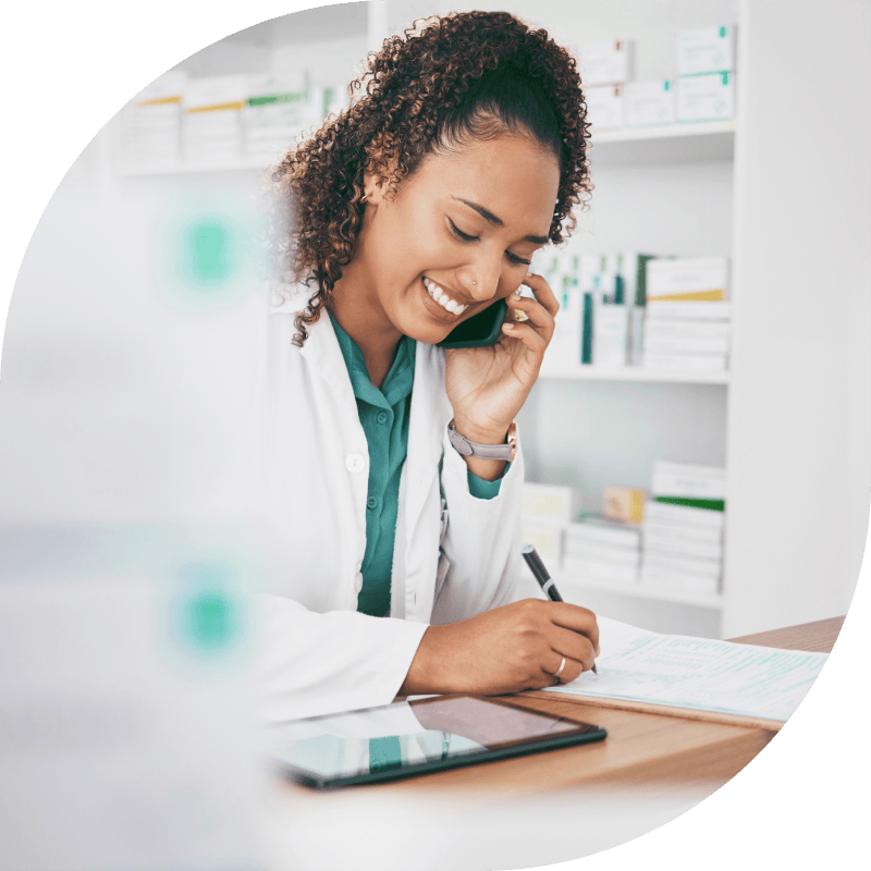 Rexall pharmacist speaking with a partner