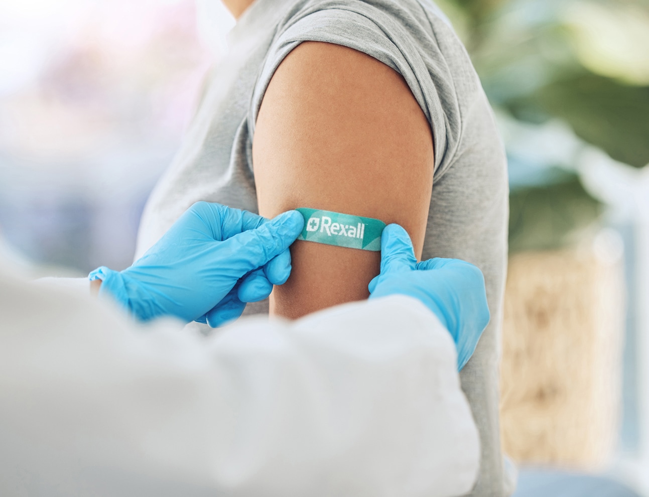 Man with scarf holding hot drink