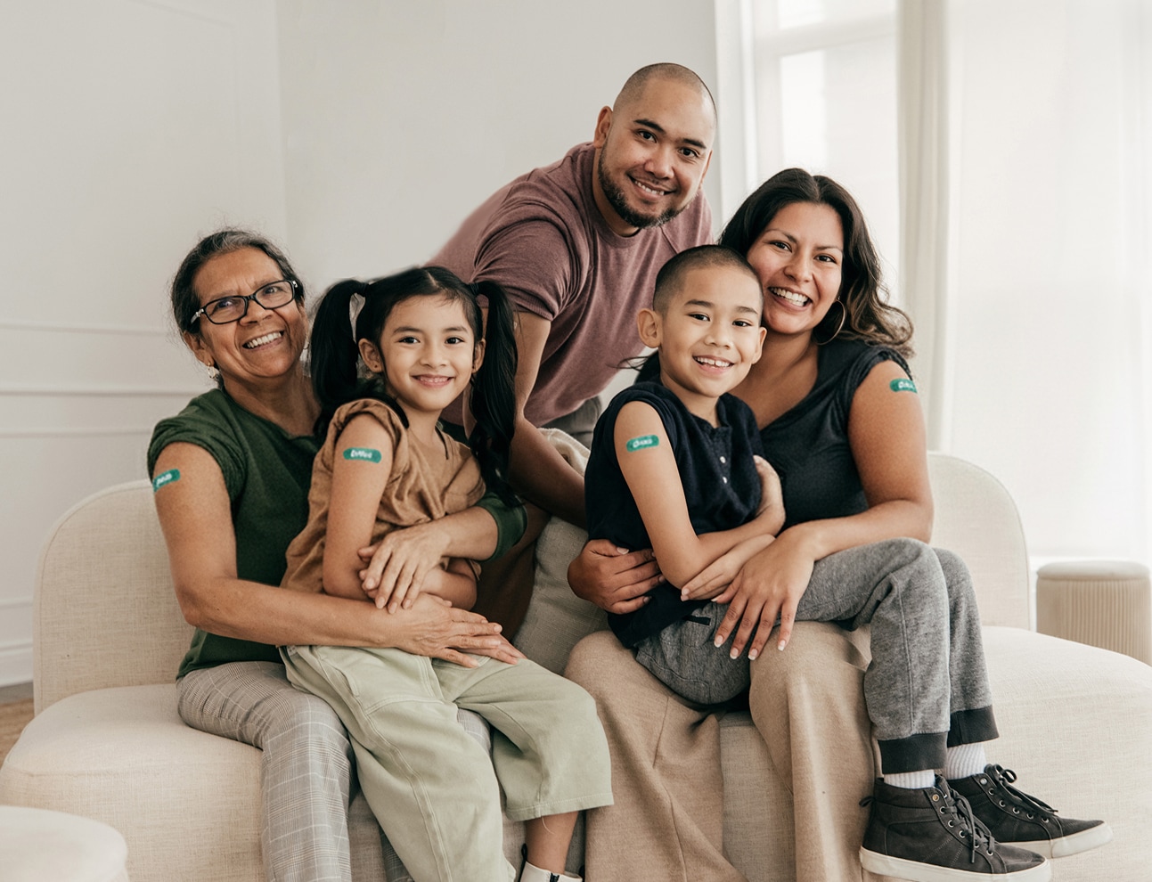 Man with scarf holding hot drink