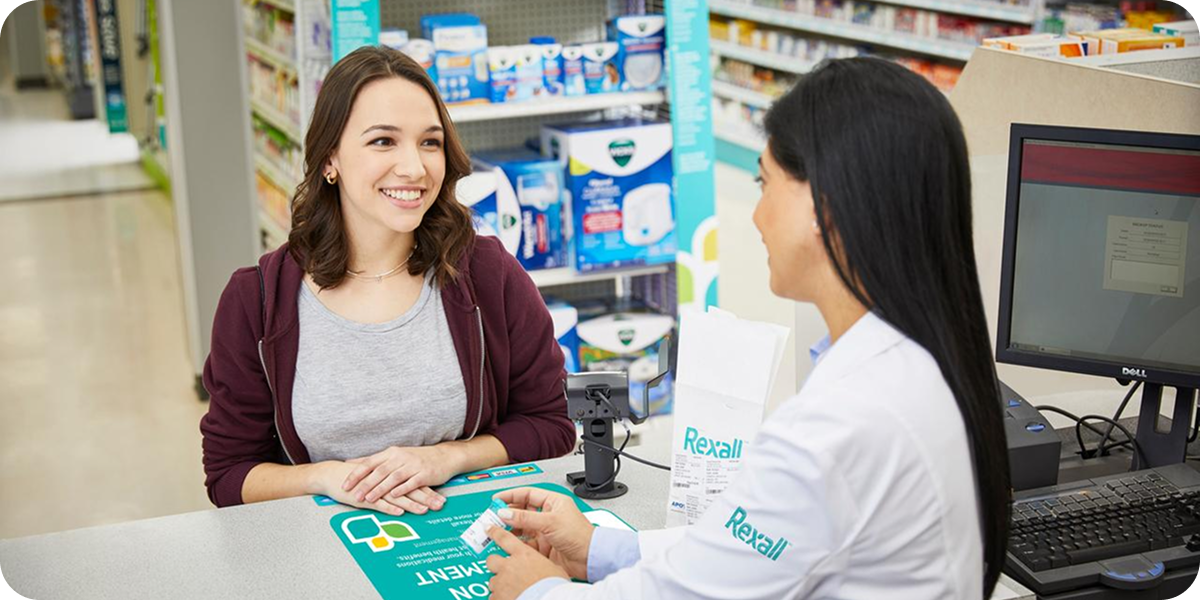 Pharmacist consulting with a patient about UTIs